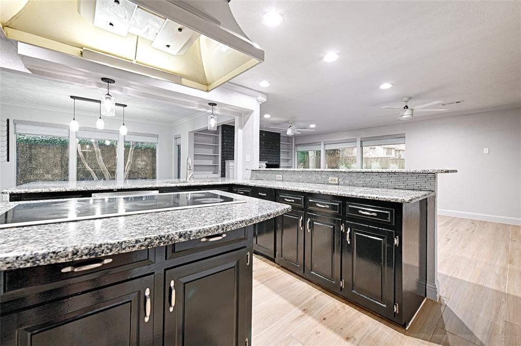 509 North Durango Circle Irving, TX 75062 - Photo 12 of 39 a kitchen with stainless steel appliances granite countertop a stove and a sink