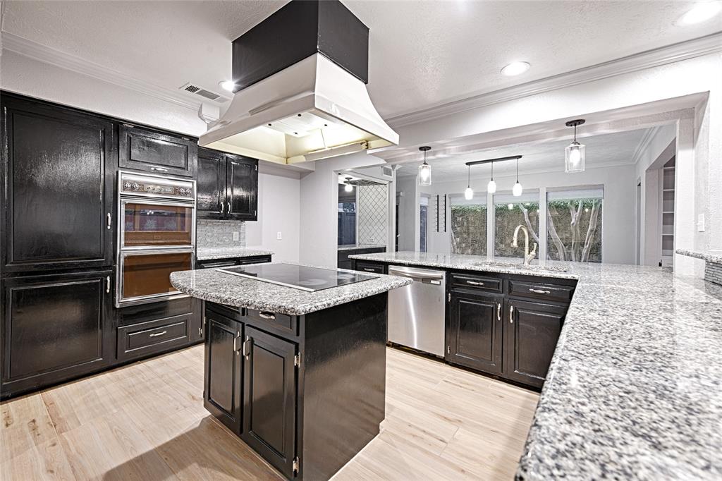 509 North Durango Circle Irving, TX 75062 - Photo 13 of 39 a kitchen with stainless steel appliances granite countertop a stove a sink dishwasher and a refrigerator
