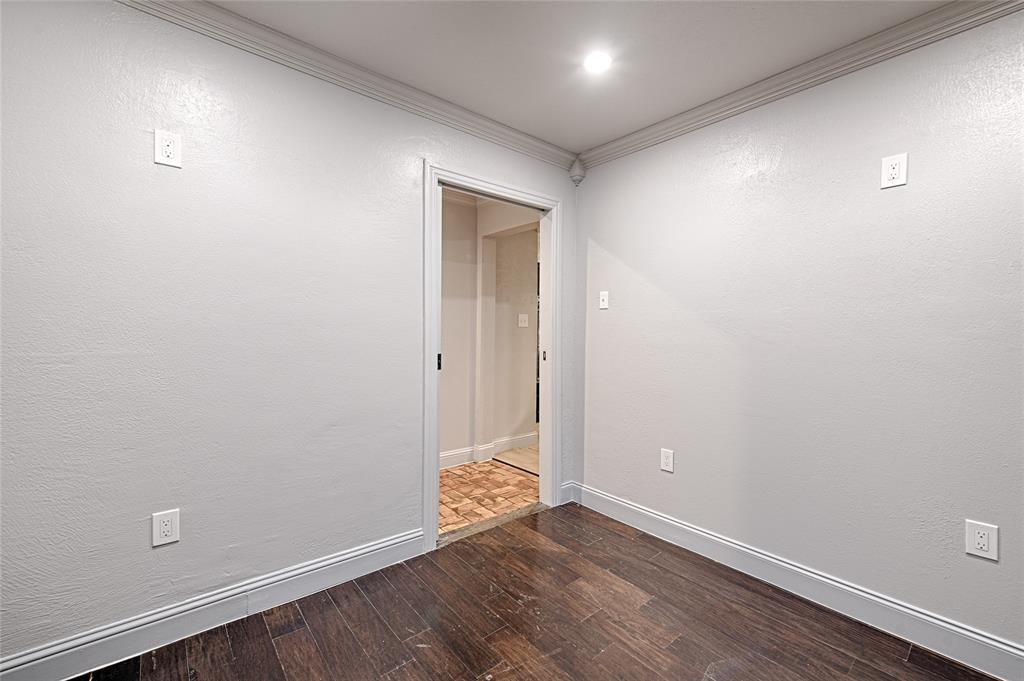 509 North Durango Circle Irving, TX 75062 - Photo 18 of 39 an empty room with wooden floor and windows