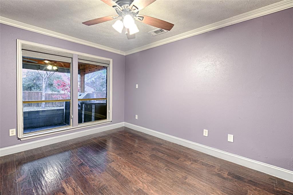 509 North Durango Circle Irving, TX 75062 - Photo 23 of 39 a view of an empty room with a window and wooden floor