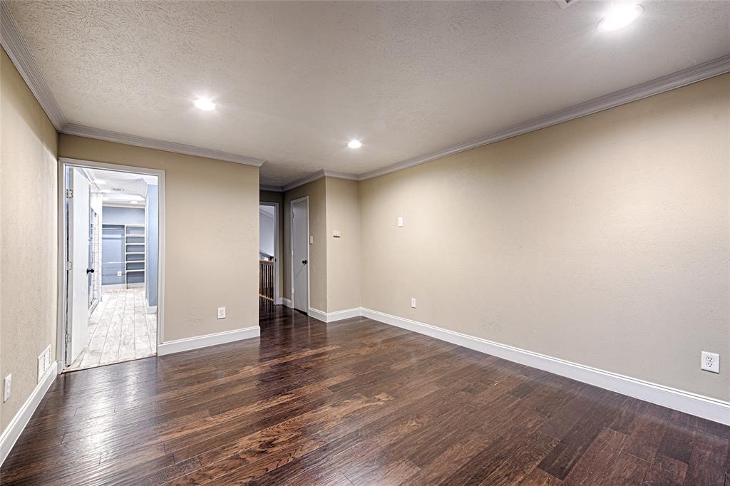 509 North Durango Circle Irving, TX 75062 - Photo 26 of 39 a view of an empty room with wooden floor and closet