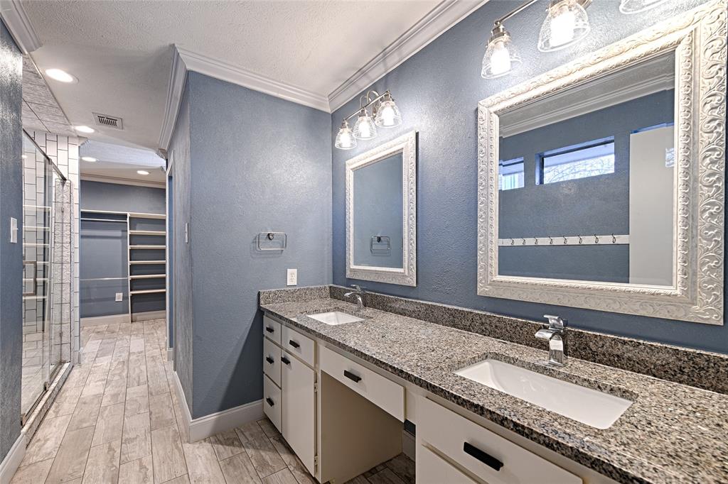 509 North Durango Circle Irving, TX 75062 - Photo 27 of 39 a bathroom with a granite countertop sink and a mirror