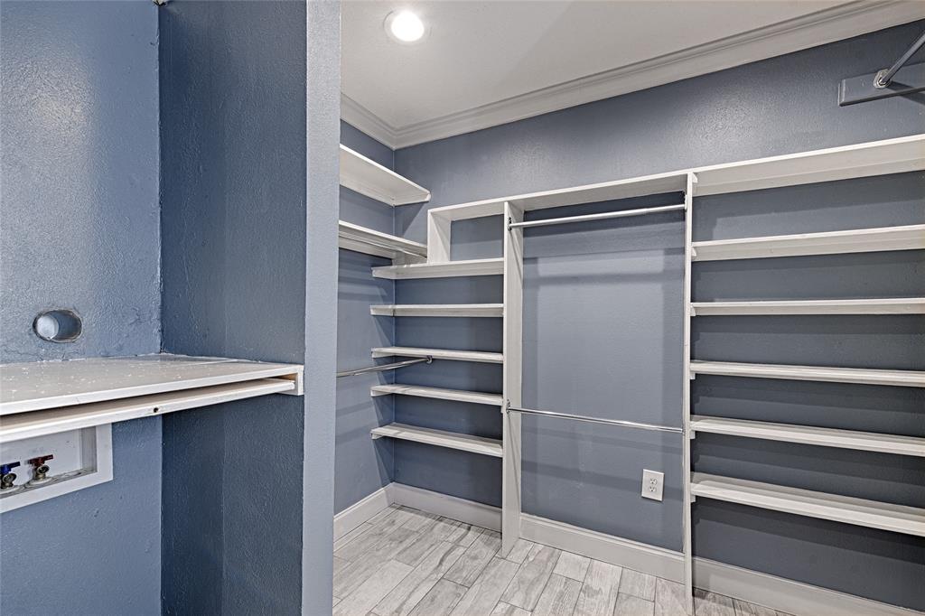 509 North Durango Circle Irving, TX 75062 - Photo 29 of 39 a view of walk in closet with empty racks