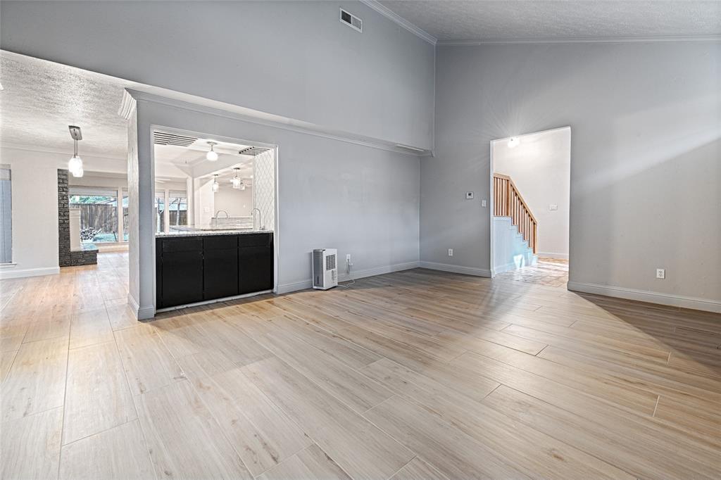 509 North Durango Circle Irving, TX 75062 - Photo 6 of 39 an empty room with wooden floor and windows