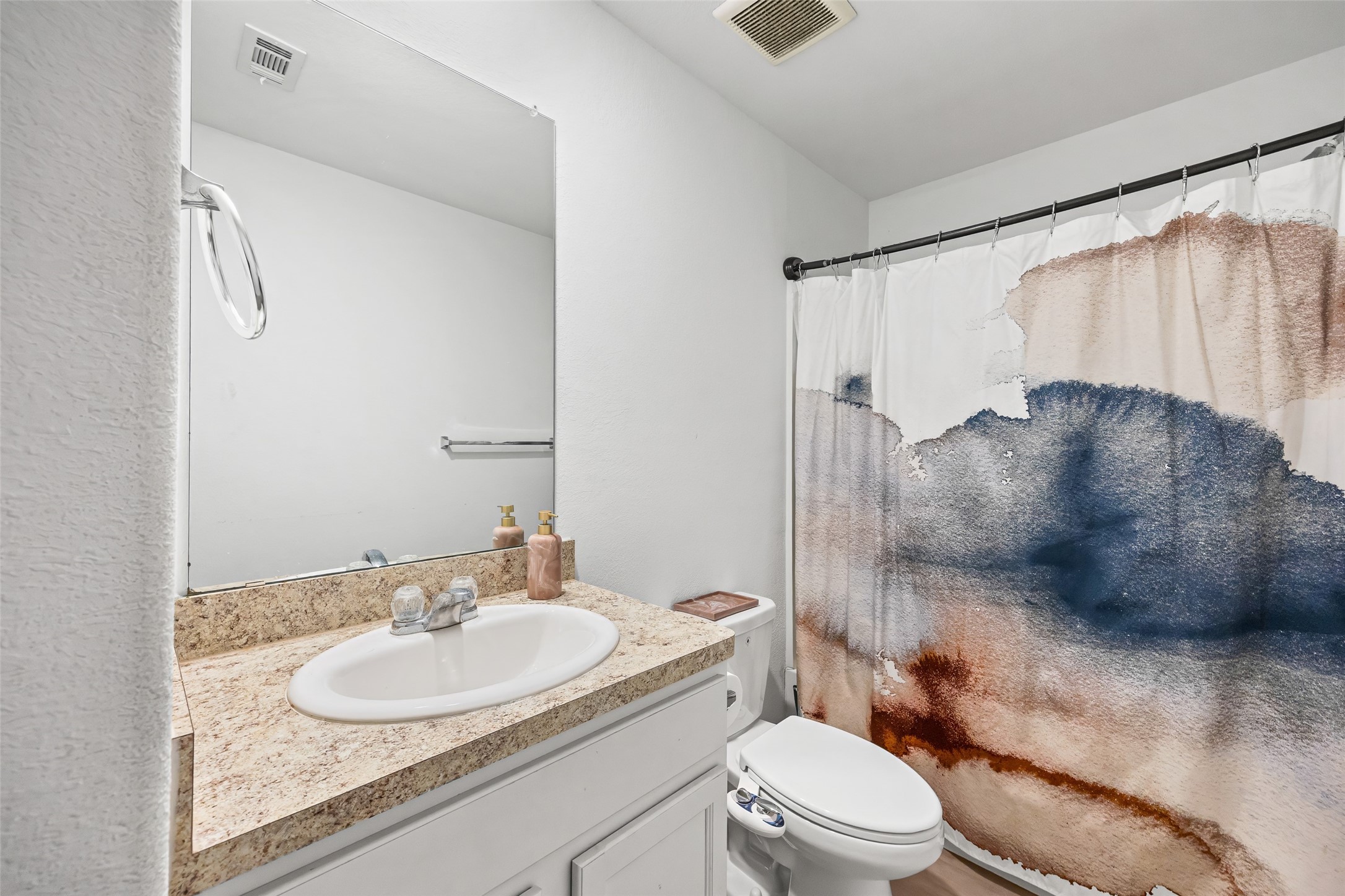 5976 Rimini Landing Lane Porter, TX 77365 - Photo 15 of 18 a bathroom with a sink toilet vanity and shower