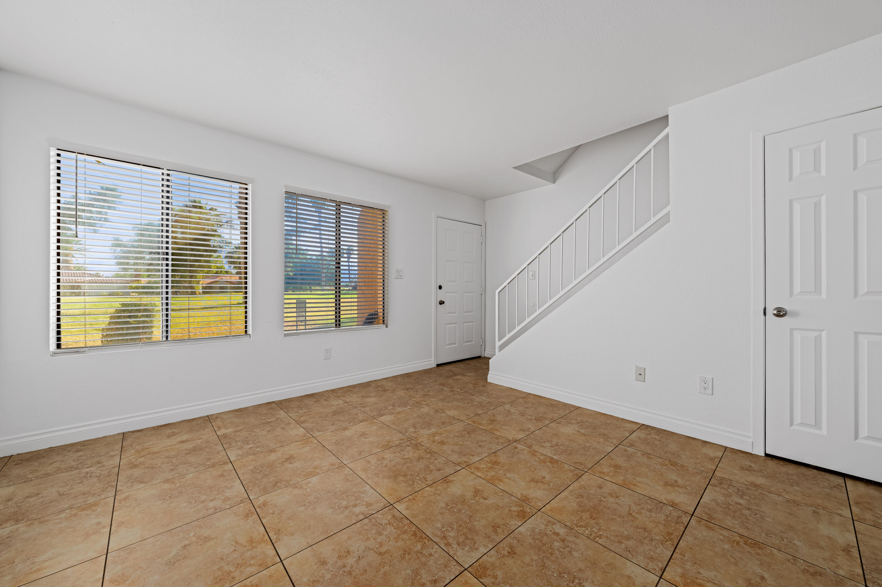82567 Ave 48, Unit 12 Indio, CA 92201 - Photo 14 of 23 a view of an empty room with a window