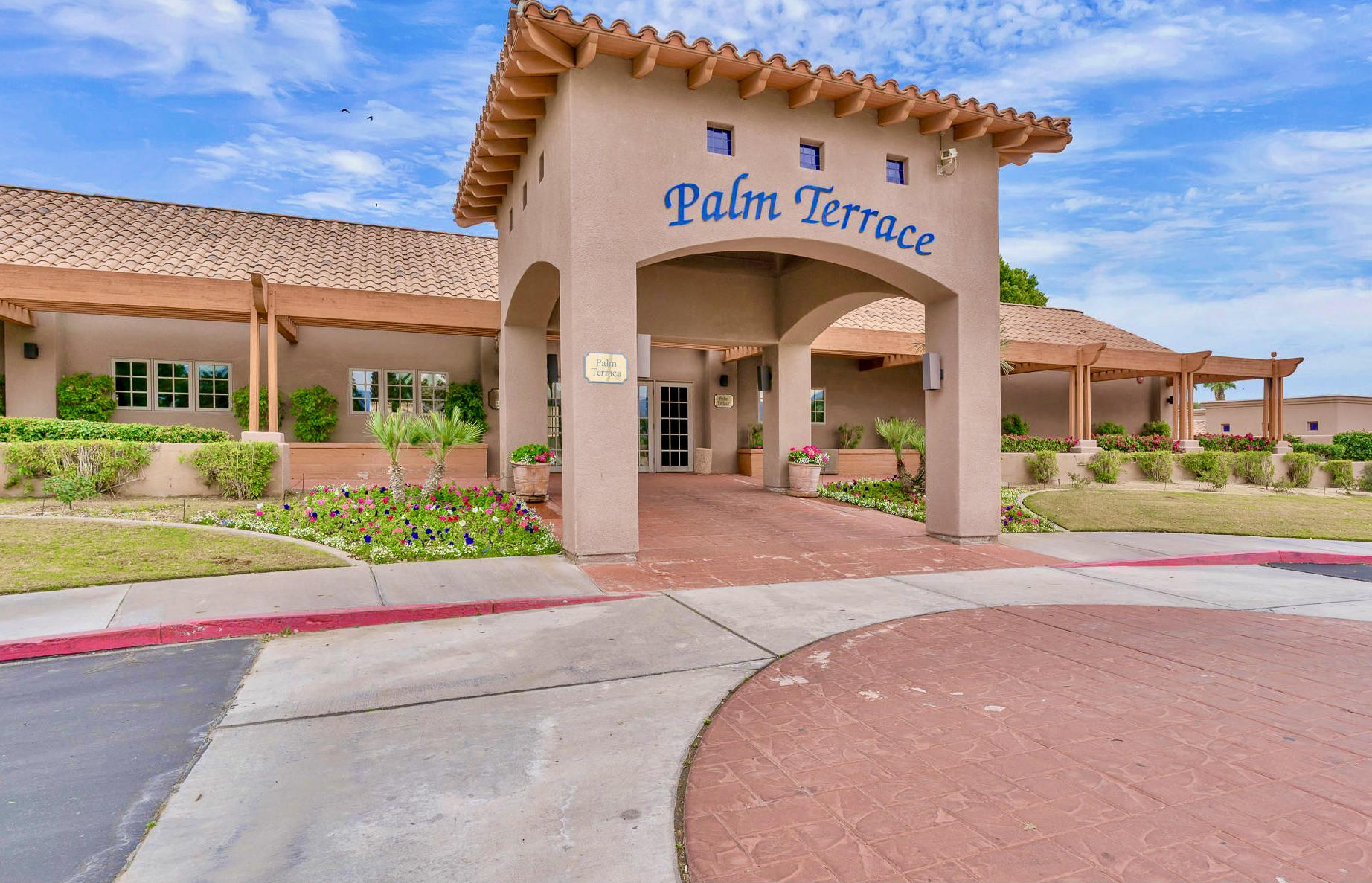 82567 Ave 48, Unit 12 Indio, CA 92201 - Photo 23 of 23 a front view of a building with garden