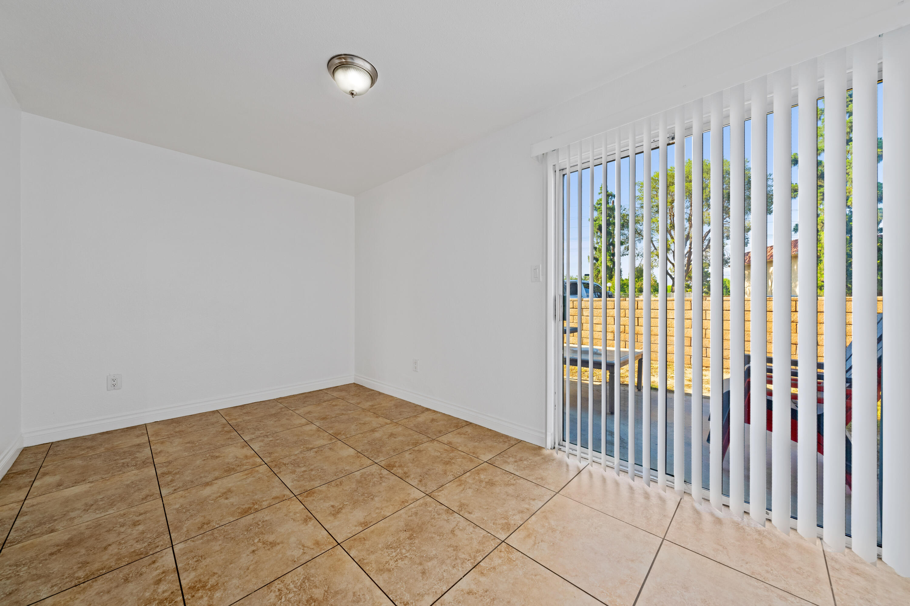 82567 Ave 48, Unit 12 Indio, CA 92201 - Photo 6 of 23 a view of an empty room with a window