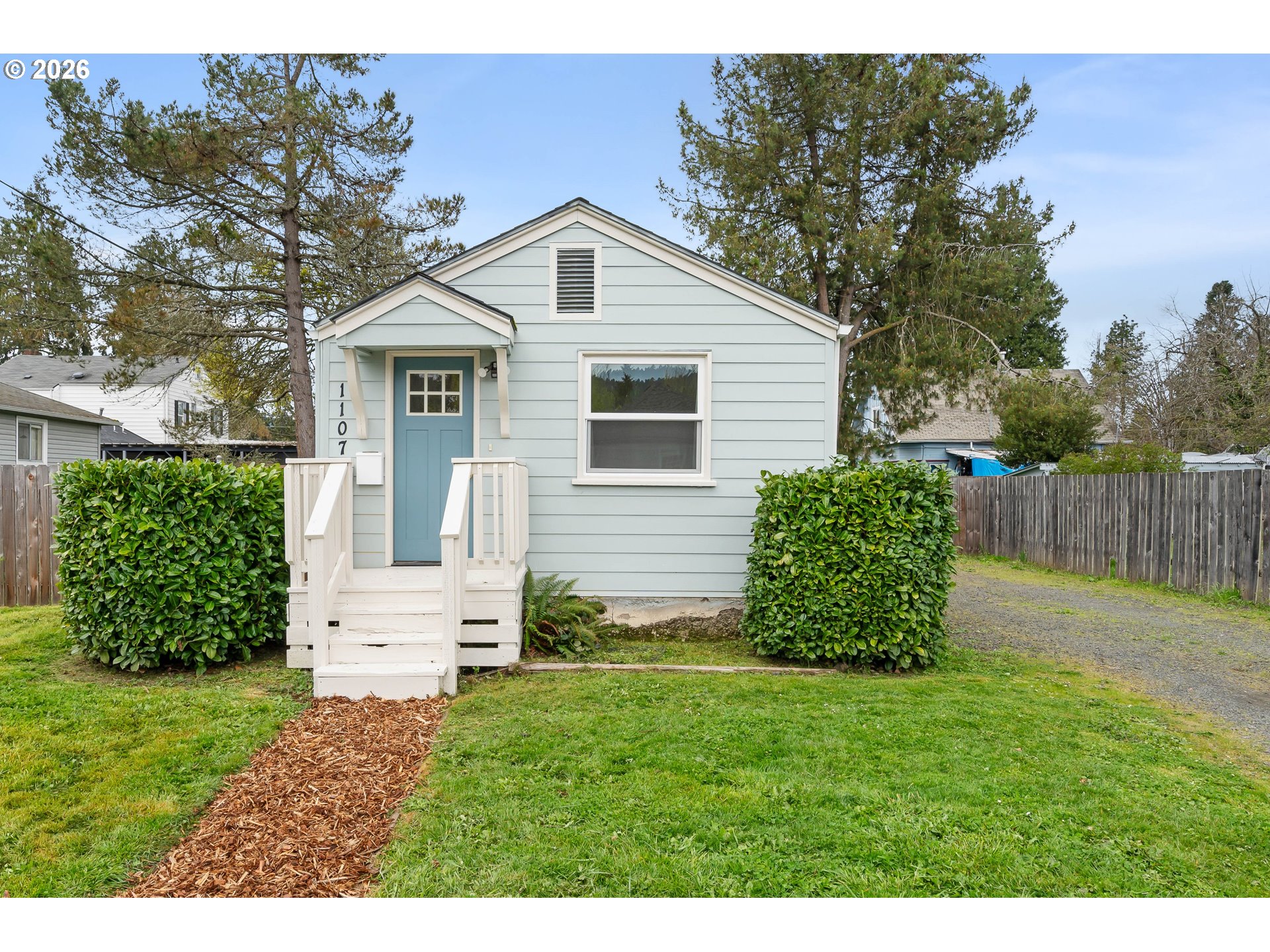 1107 South 7th Street Cottage Grove, OR 97424 - Photo 1 of 34 a front view of a house with a yard