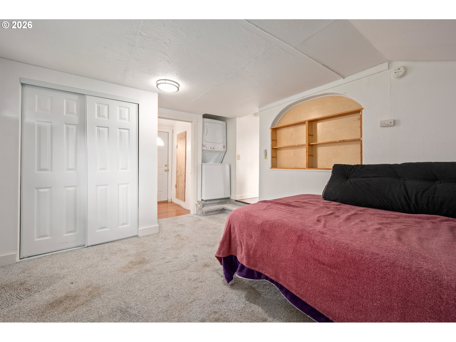 1107 South 7th Street Cottage Grove, OR 97424 - Photo 17 of 34 a bedroom with a bed and a large window
