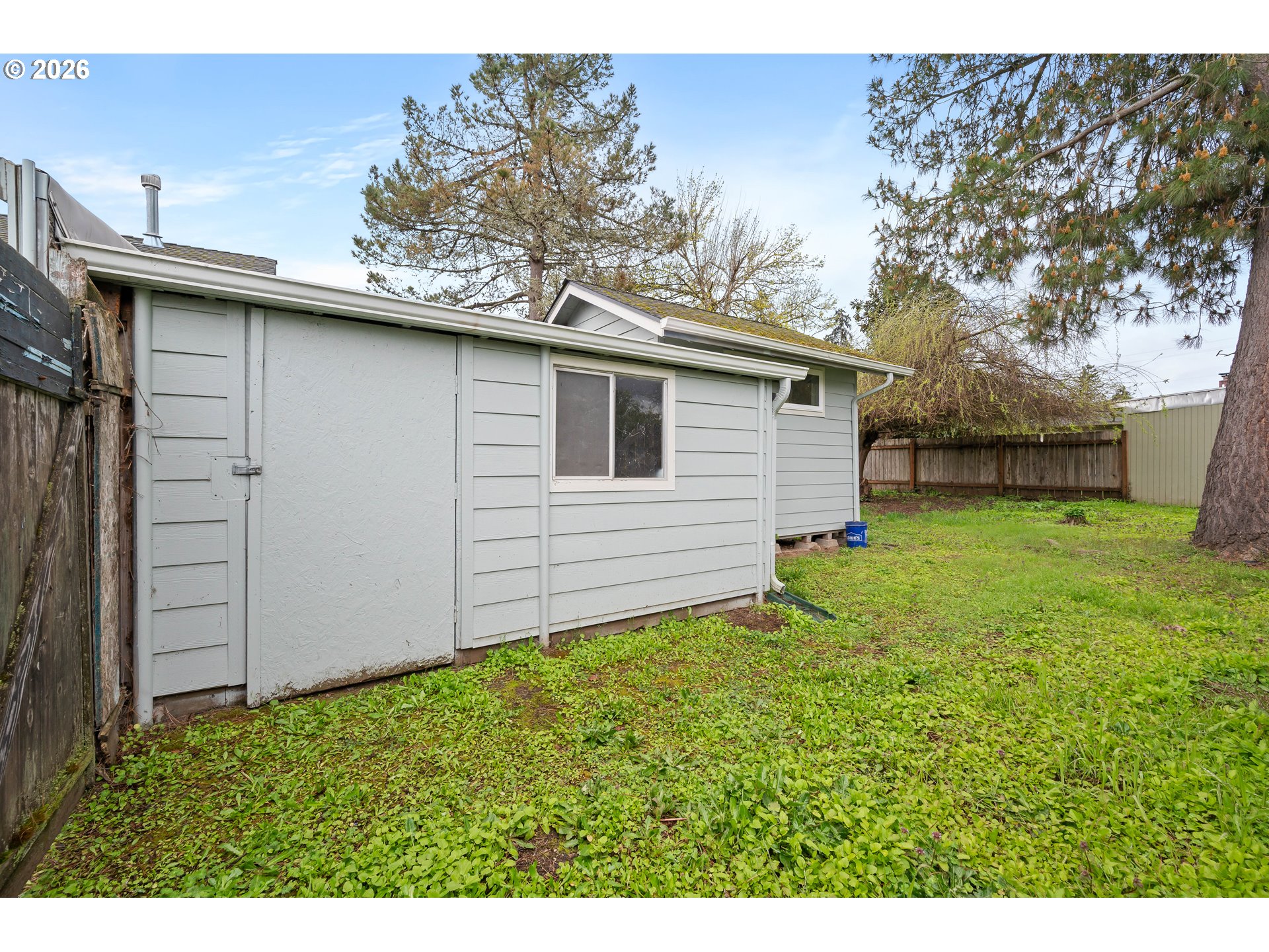 1107 South 7th Street Cottage Grove, OR 97424 - Photo 29 of 34 a backyard of a house with lots of green space