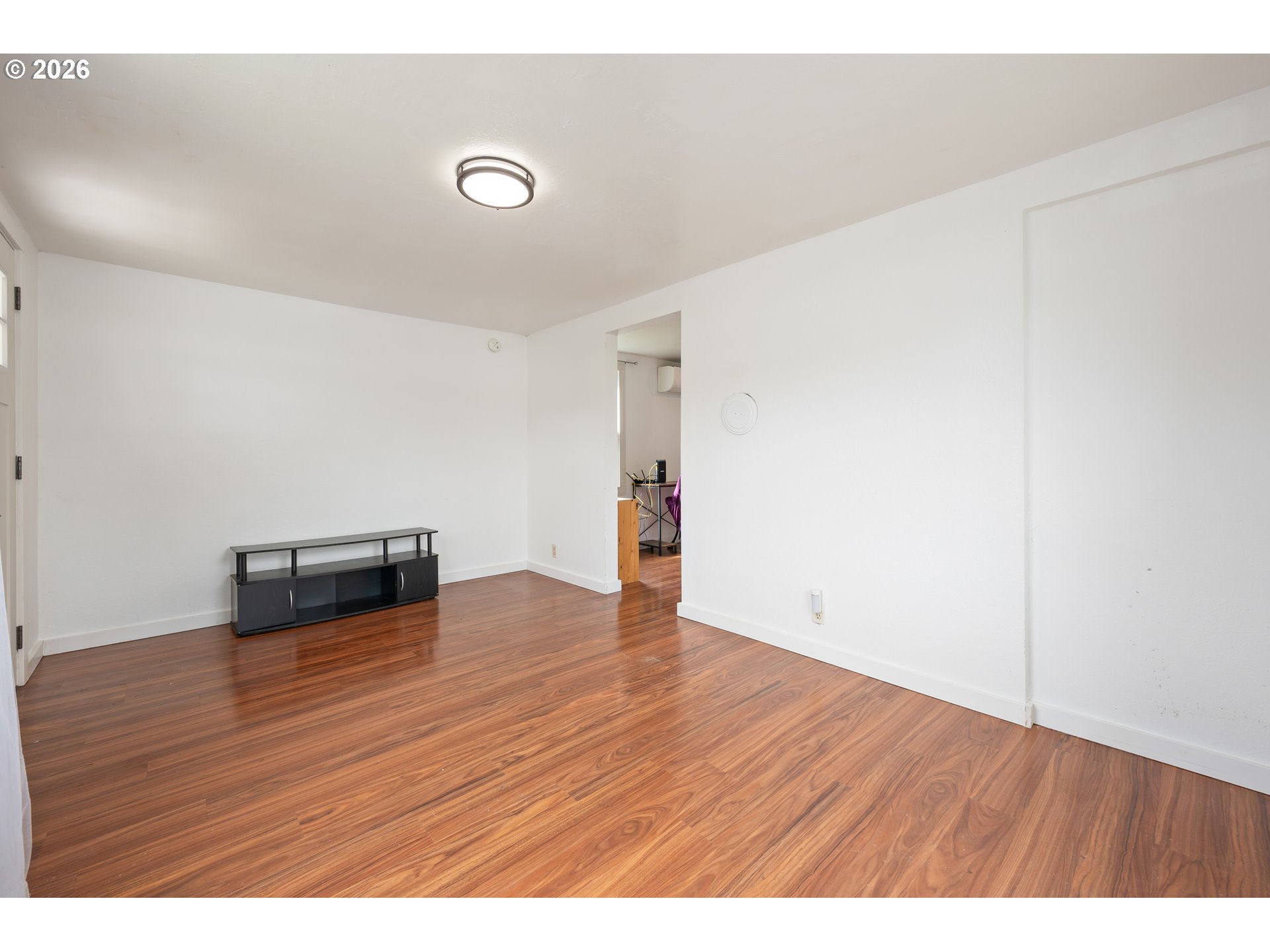1107 South 7th Street Cottage Grove, OR 97424 - Photo 5 of 34 a view of an empty room with wooden floor