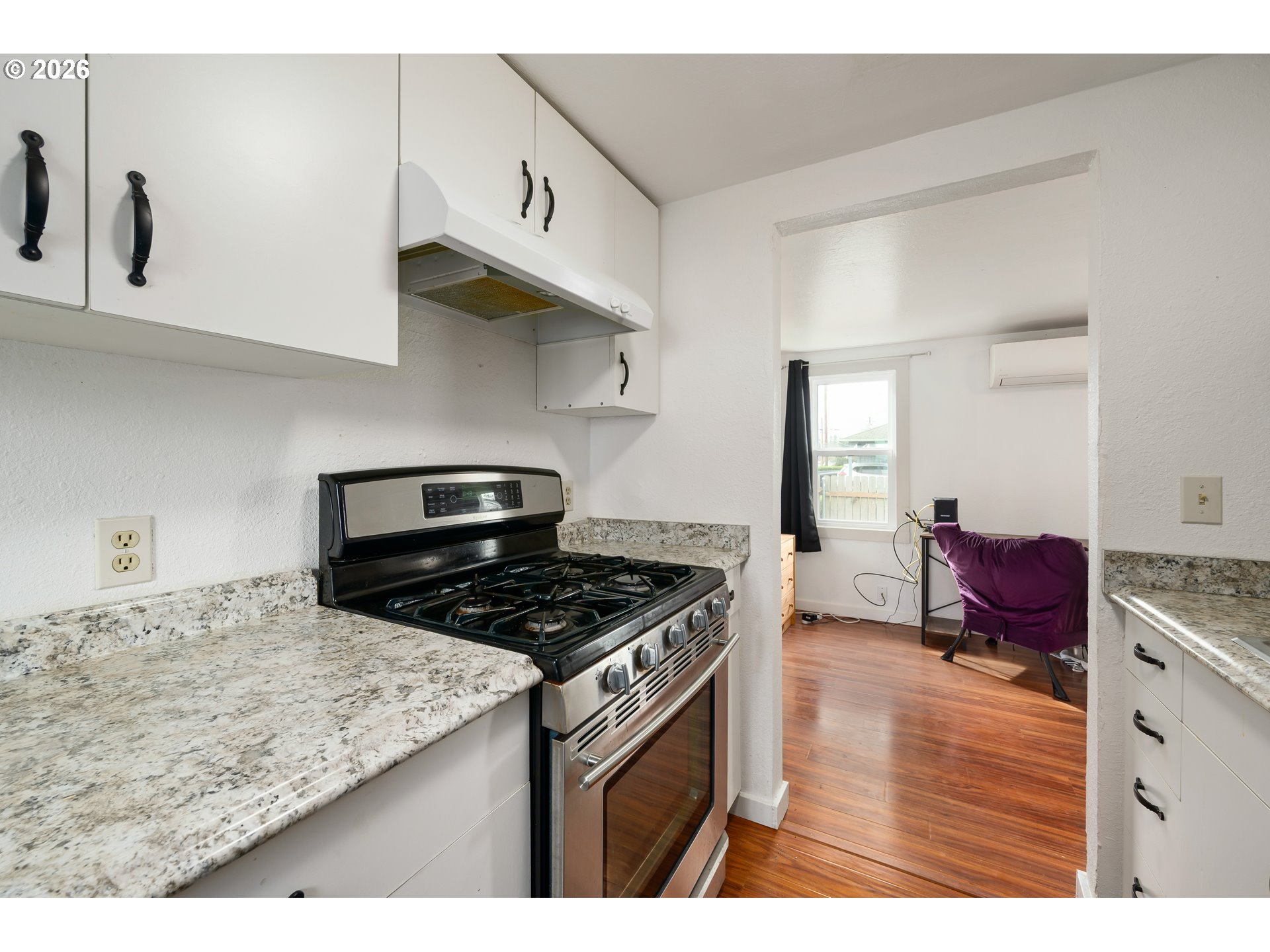 1107 South 7th Street Cottage Grove, OR 97424 - Photo 10 of 34 a kitchen with stainless steel appliances granite countertop a stove and a sink