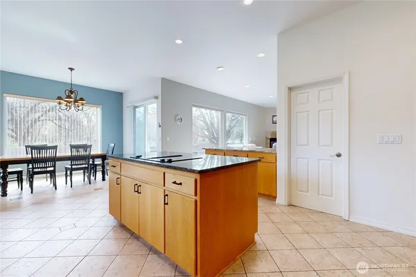 a kitchen with stainless steel appliances granite countertop a stove and a sink