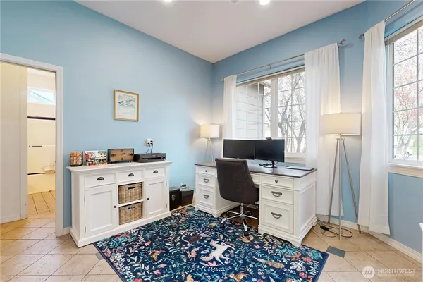 a view of workspace with furniture and window