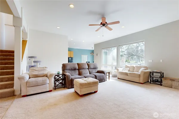 a living room with furniture and a large window