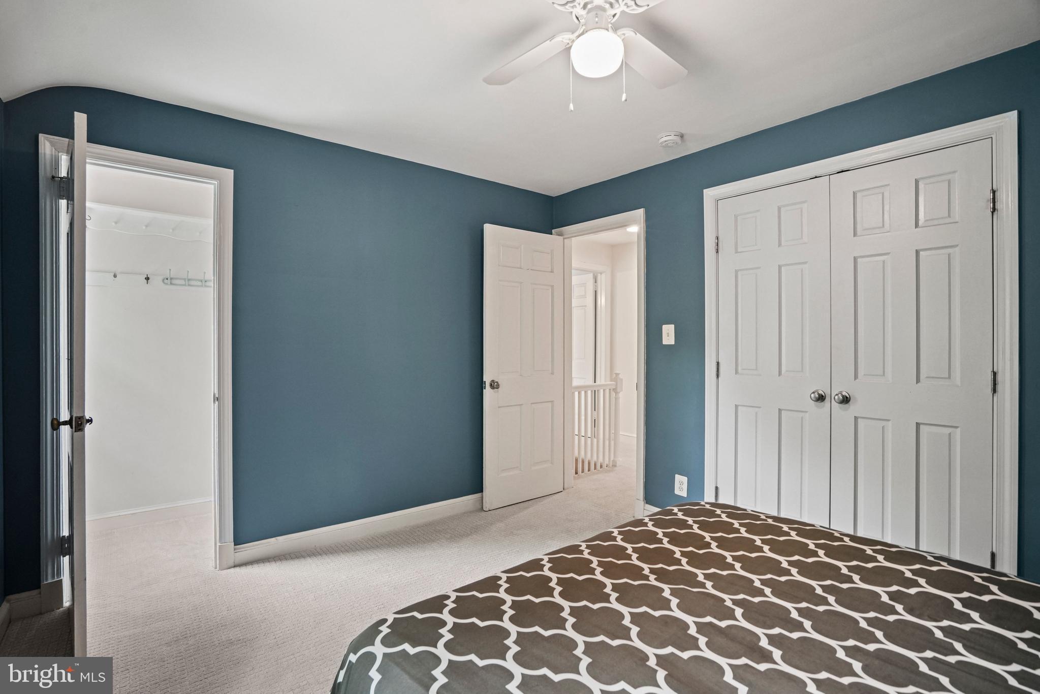 1907 Brisbane Street Silver Spring, MD 20902 - Photo 23 of 39 a bedroom with wooden floor closet and a bathroom