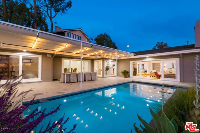 a view of a patio with couches chairs and potted plants