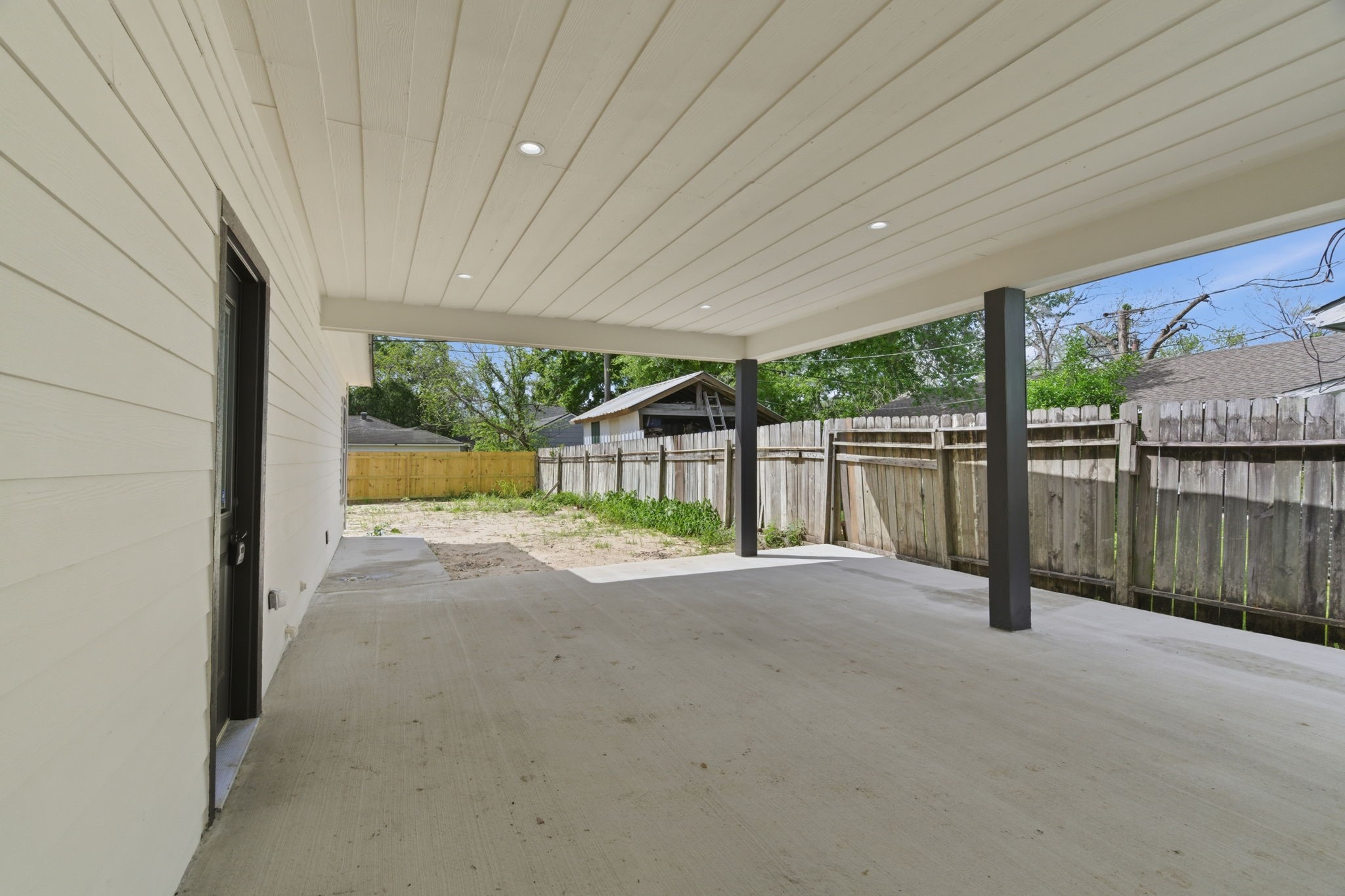 7040 Kinney Street Houston, TX 77087 - Photo 30 of 47 a view of a backyard with wooden fence