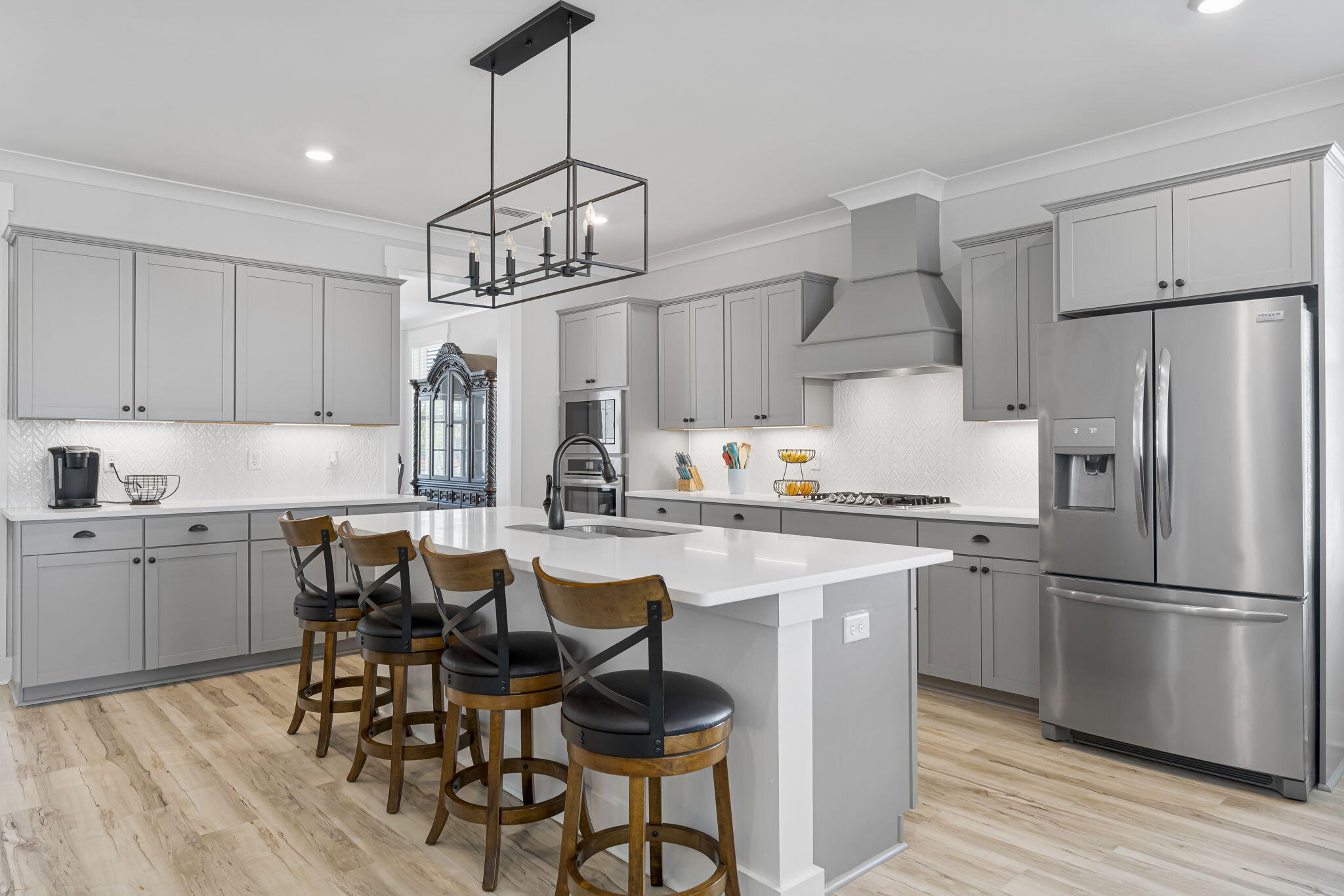 1921 Rushes Avenue Panama City, FL 32405 - Photo 2 of 43 a kitchen with stainless steel appliances a dining table chairs refrigerator and sink