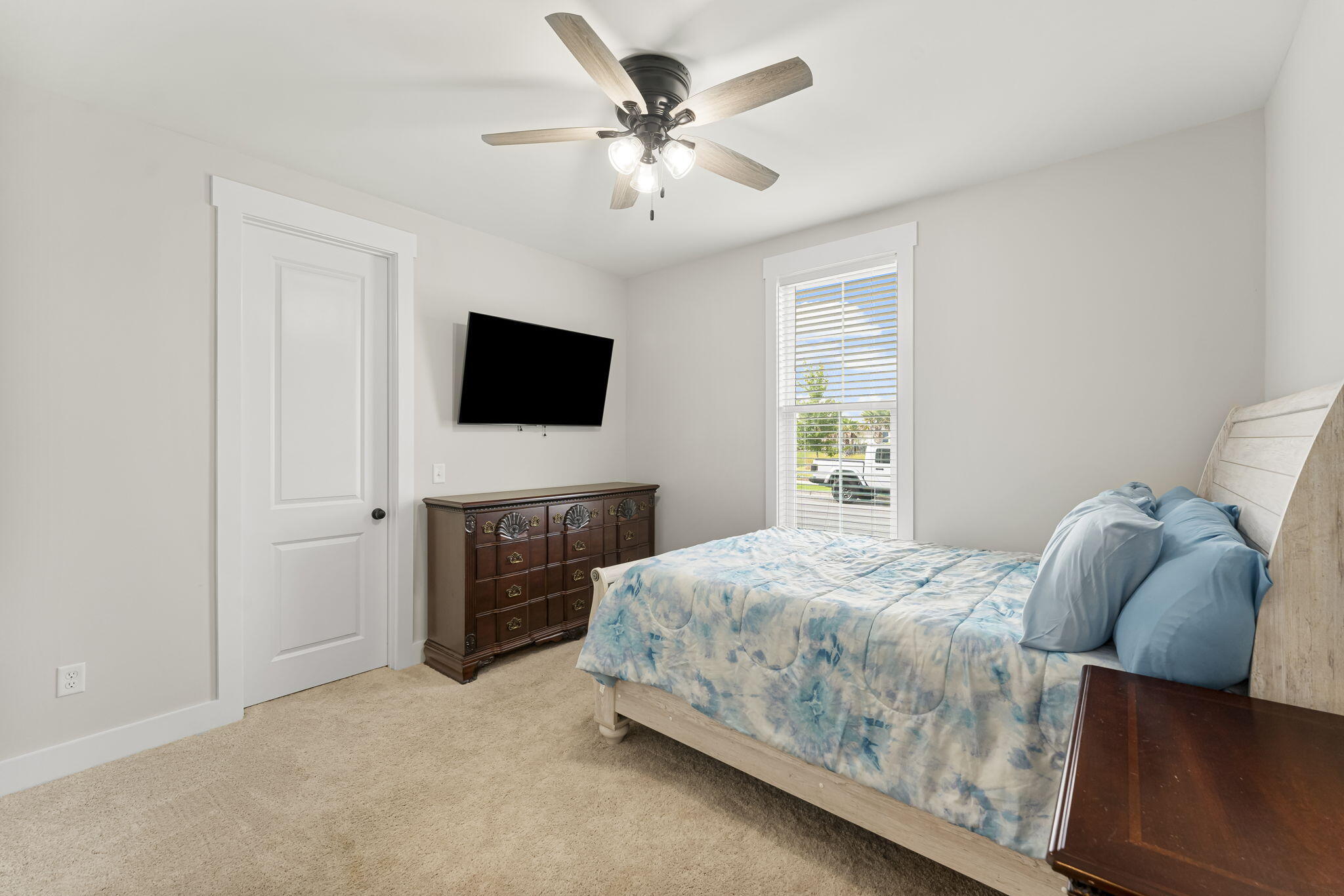 1921 Rushes Avenue Panama City, FL 32405 - Photo 8 of 43 a bedroom with a bed and a flat screen tv