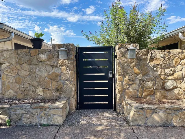 a view of outdoor space with brick wall