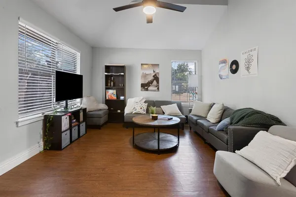 a living room with furniture and a flat screen tv