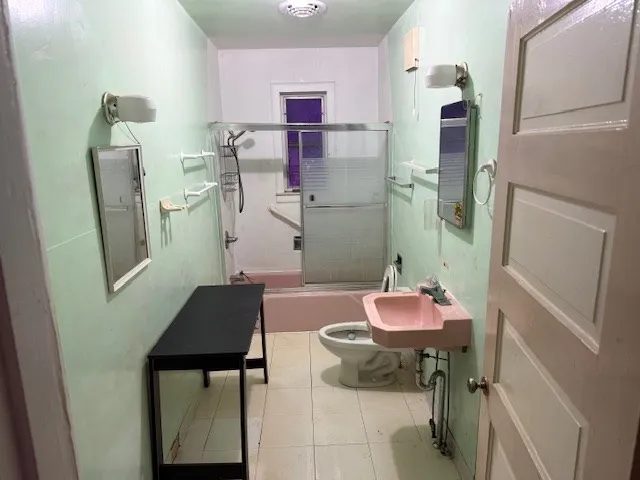 a bathroom with a sink and mirror