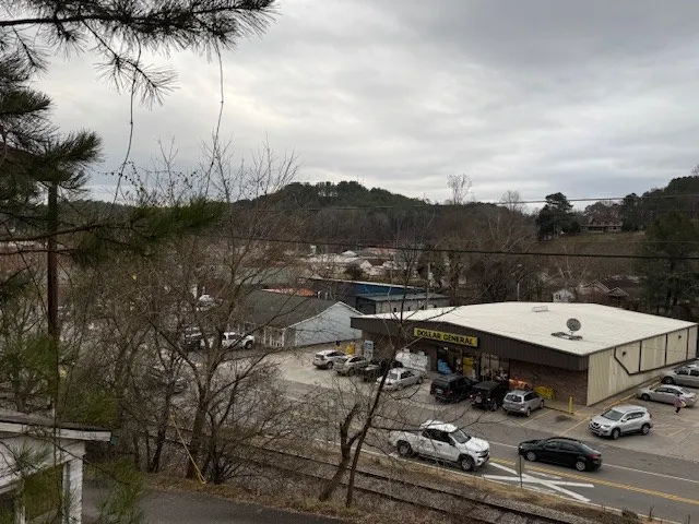 a view of a terrace with a table and chairs