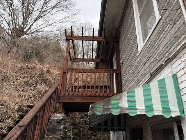 a view of a porch with a bench