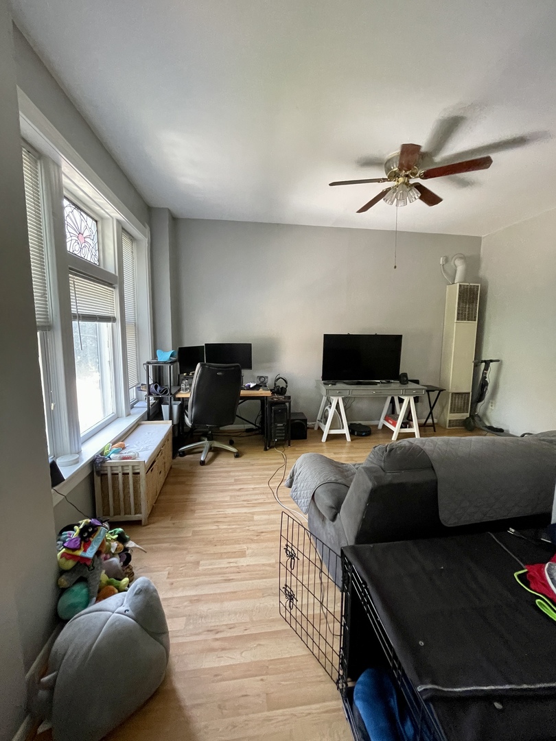 1907 West Cortland Street, Unit 2 Chicago, IL 60622 - Photo 3 of 11 a living room with furniture and a flat screen tv