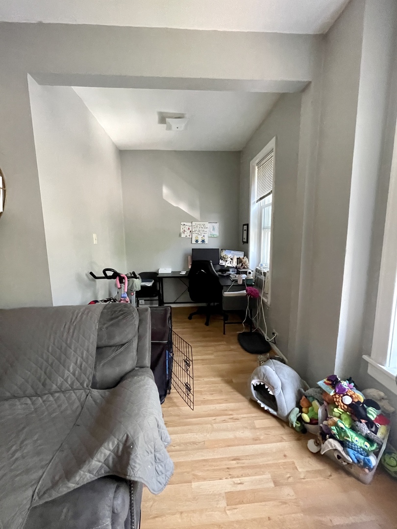 1907 West Cortland Street, Unit 2 Chicago, IL 60622 - Photo 4 of 11 a living room with furniture and a couch
