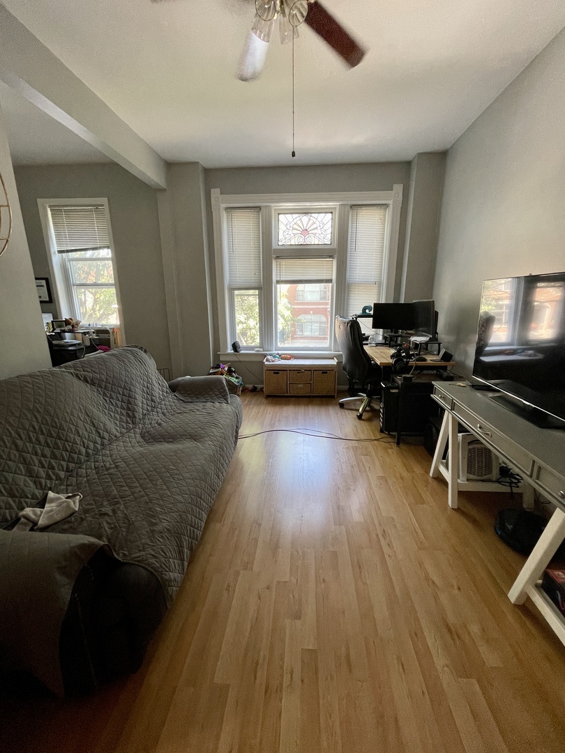 1907 West Cortland Street, Unit 2 Chicago, IL 60622 - Photo 5 of 11 a living room with furniture and a wooden floor