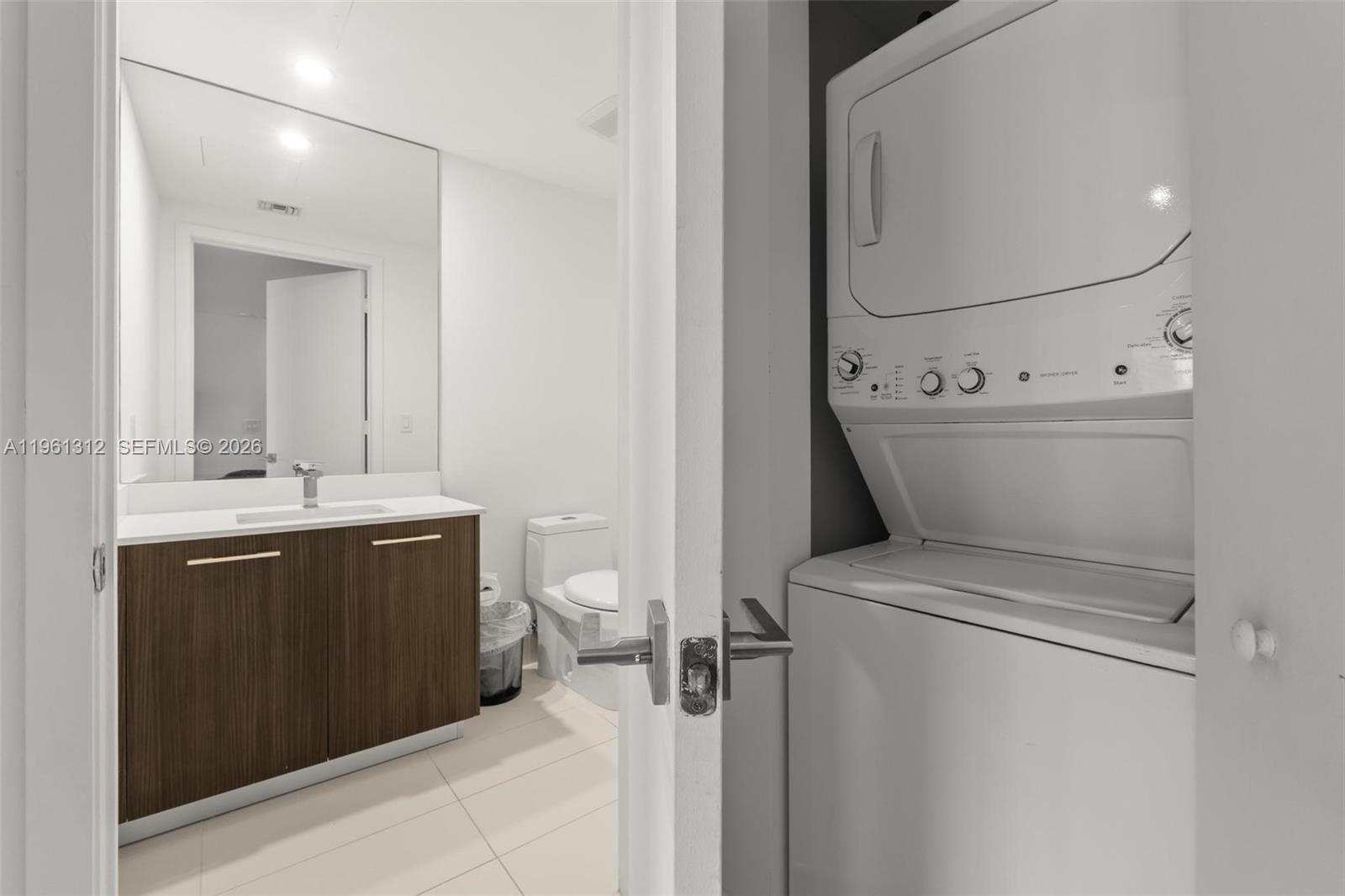 45 Southwest 9th Street, Unit 1109 Miami, FL 33130 - Photo 11 of 25 a view of bathroom with a sink and mirror