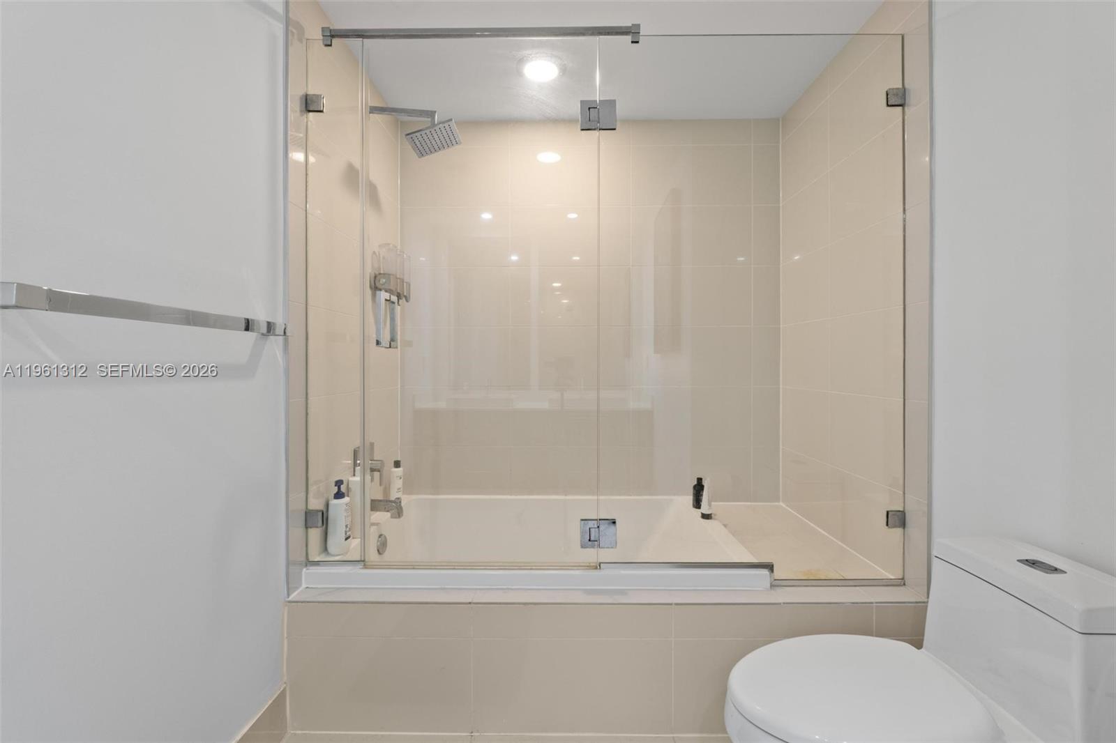 45 Southwest 9th Street, Unit 1109 Miami, FL 33130 - Photo 16 of 25 a bathroom with a toilet and a bathtub