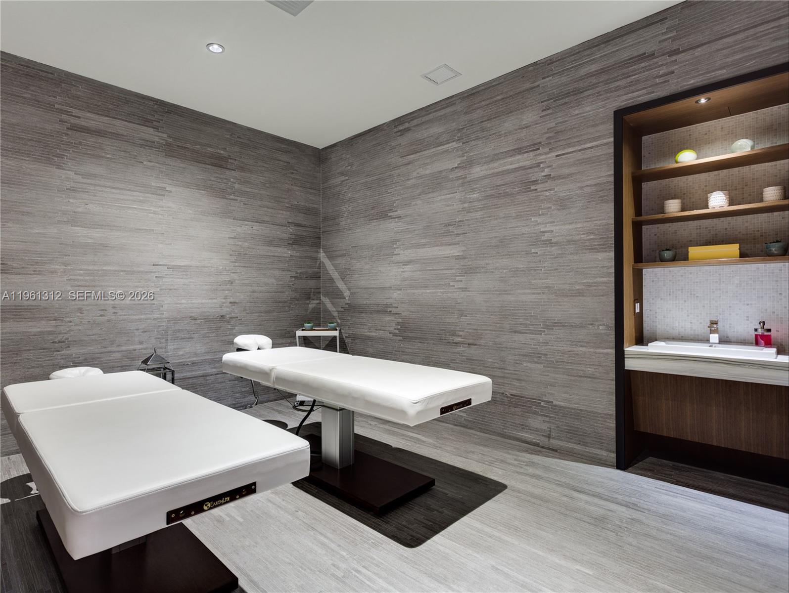 45 Southwest 9th Street, Unit 1109 Miami, FL 33130 - Photo 24 of 25 a bathroom with a sink and a mirror