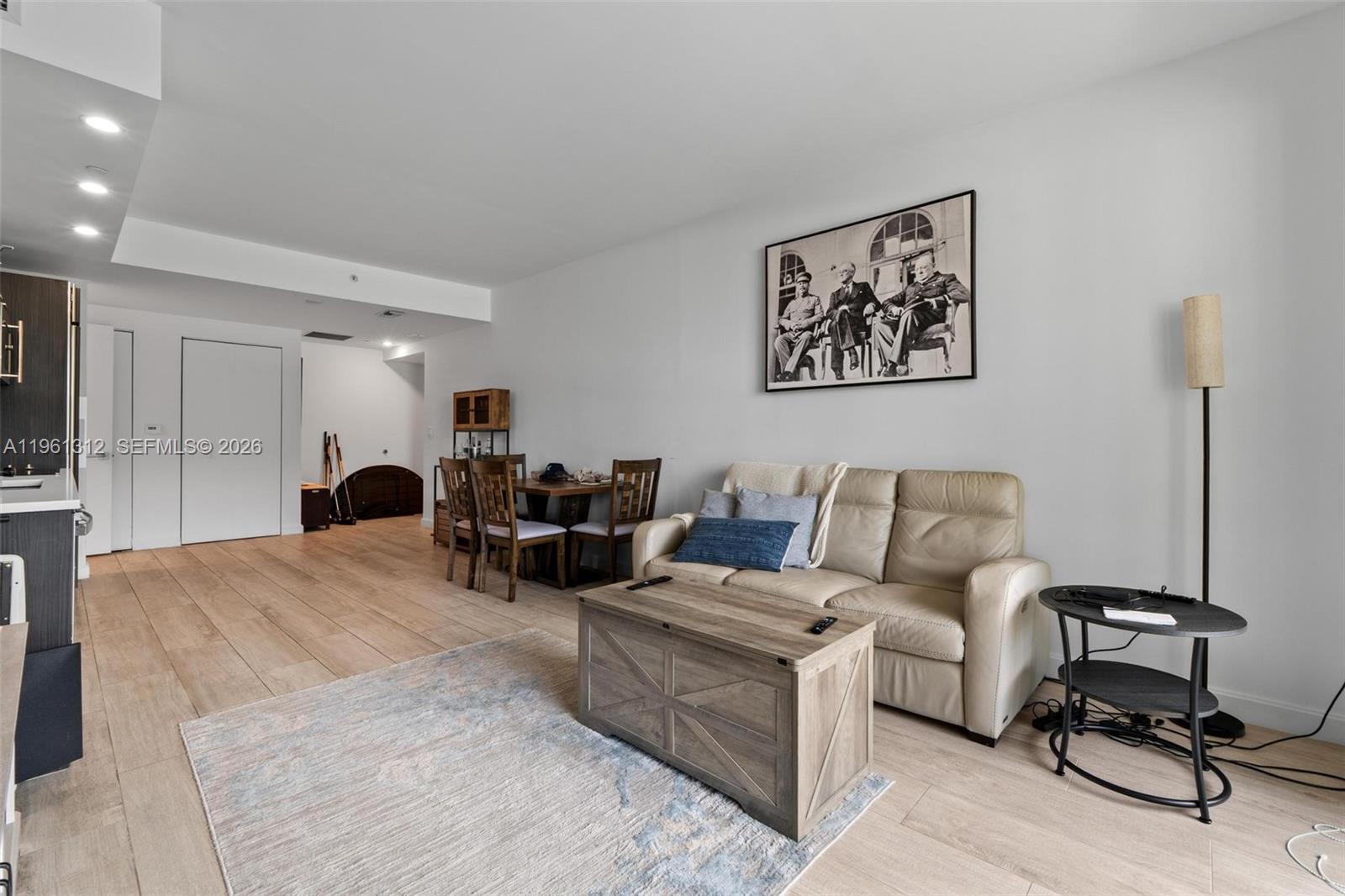 45 Southwest 9th Street, Unit 1109 Miami, FL 33130 - Photo 7 of 25 a living room with furniture and a table