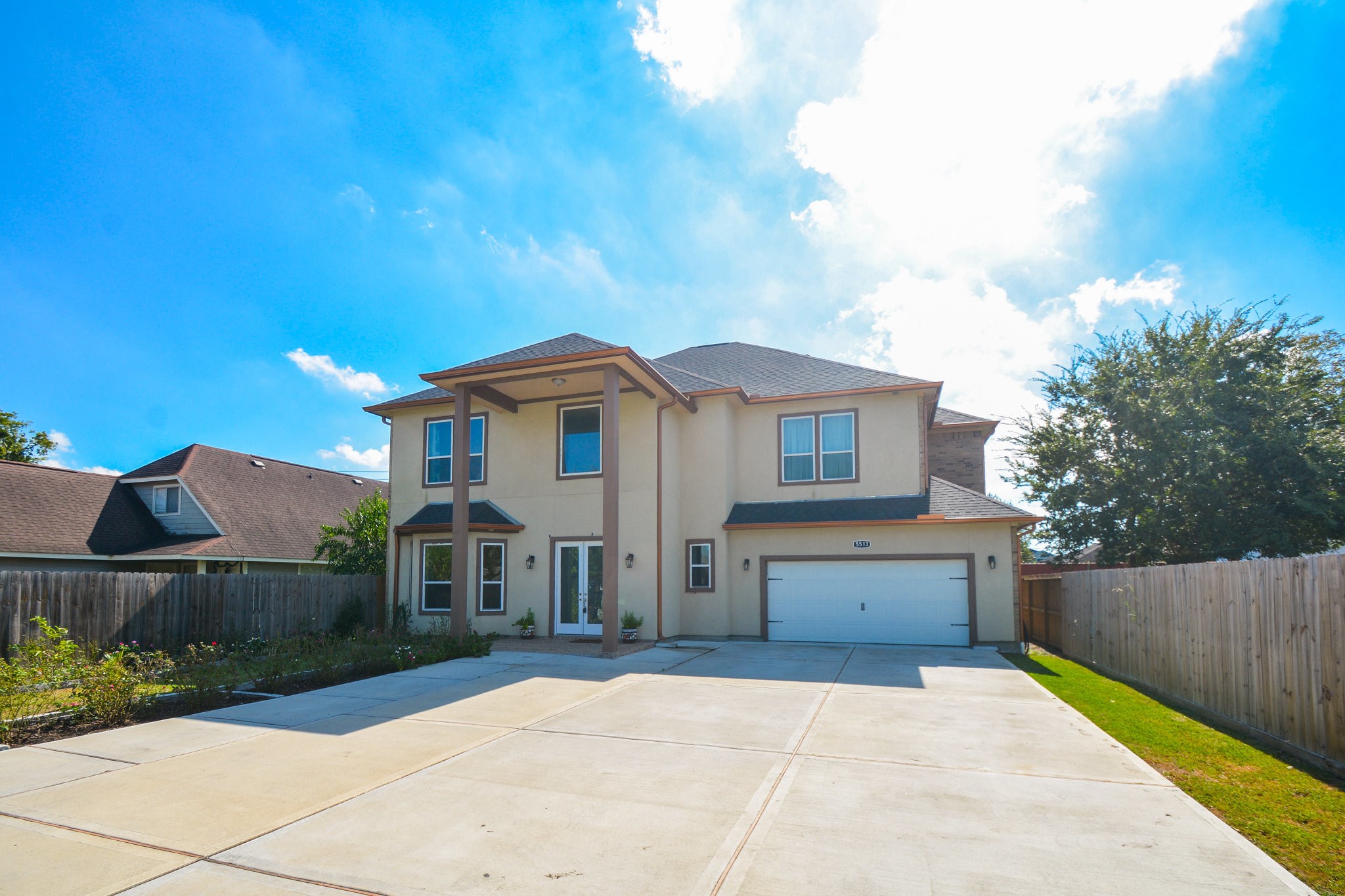5513 Lotus Street Houston, TX 77085 - Photo 1 of 50 a front view of house with yard and car parked