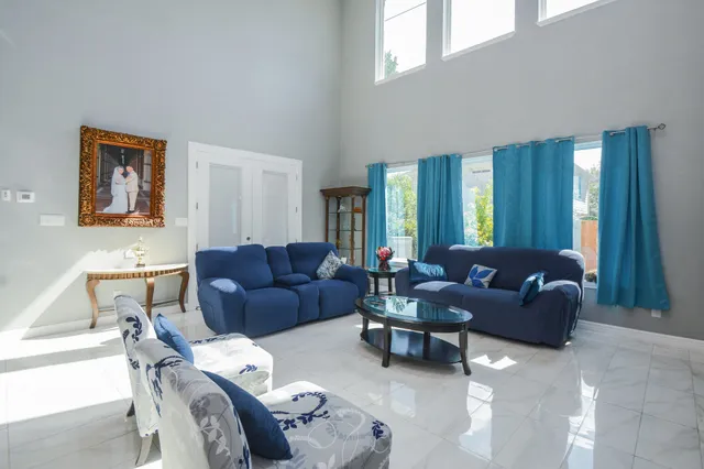 a living room with furniture and a large window