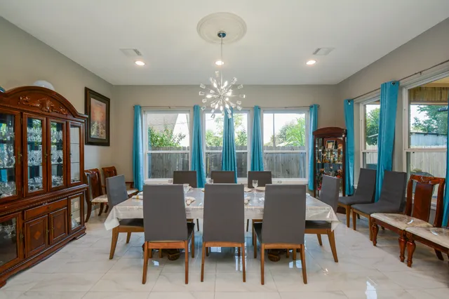a view of a dining room with furniture window and outside view
