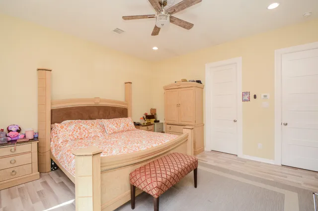 a bedroom with a bed and a dresser