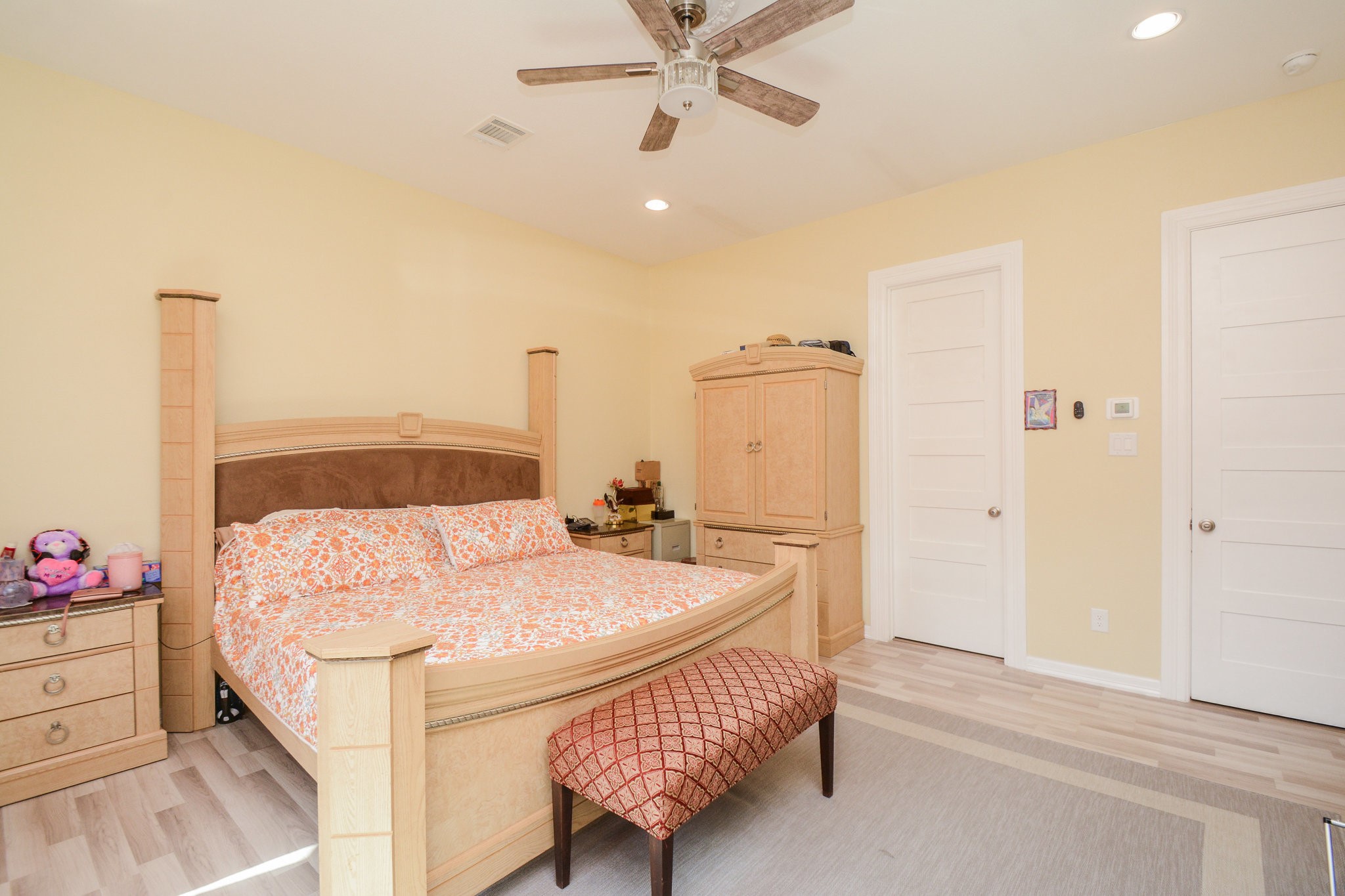 5513 Lotus Street Houston, TX 77085 - Photo 22 of 50 a bedroom with a bed and a dresser