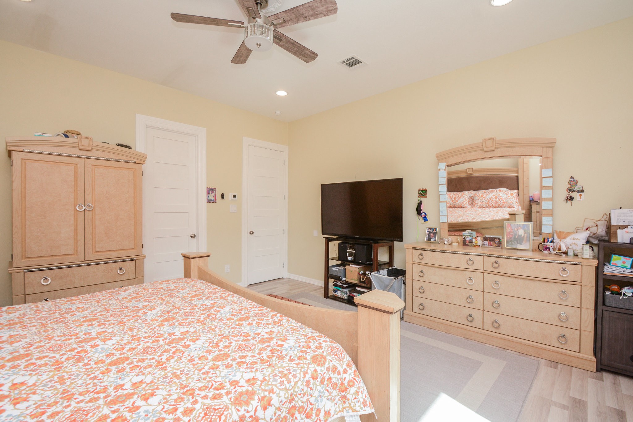 5513 Lotus Street Houston, TX 77085 - Photo 23 of 50 a bedroom with a bed and a flat screen tv