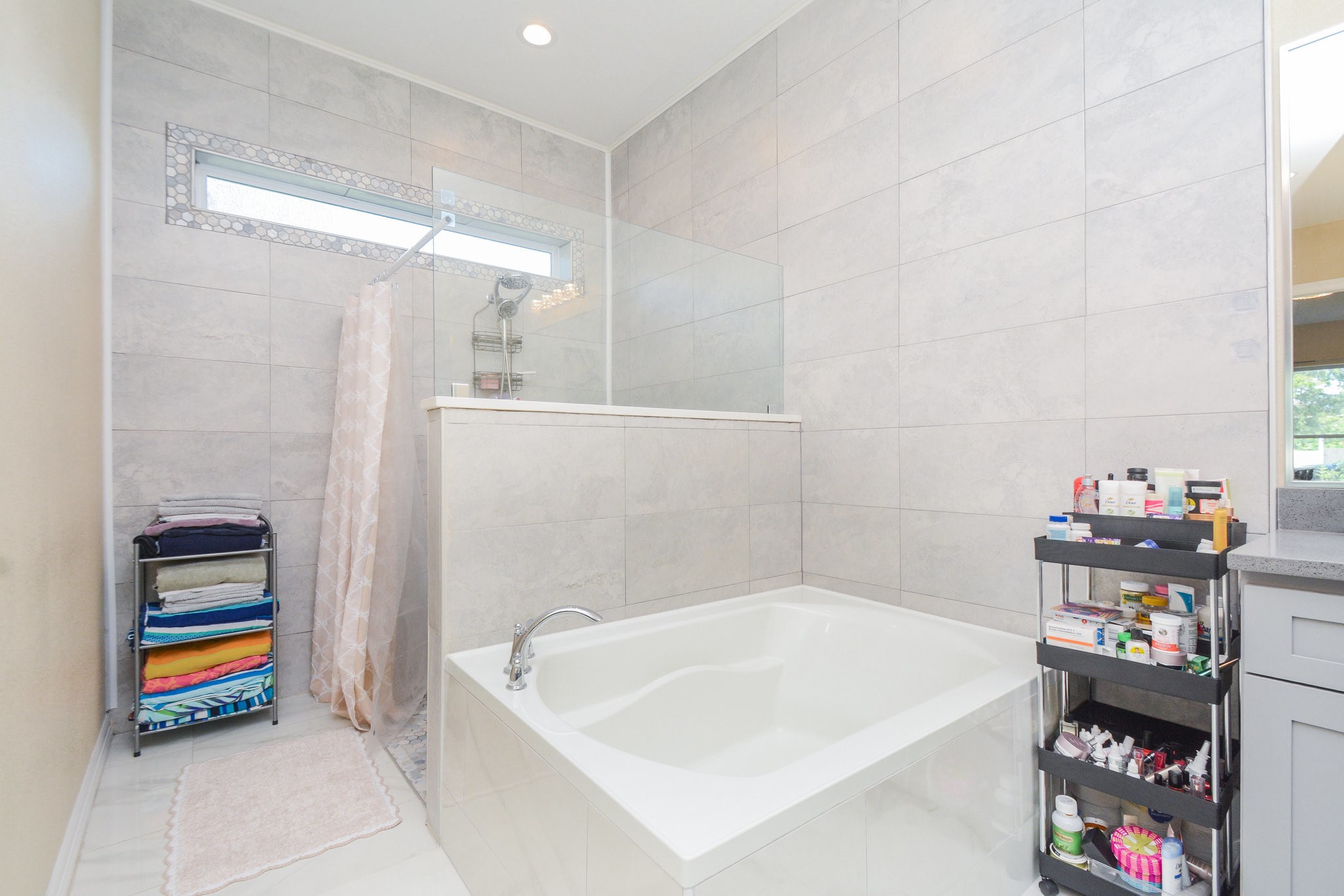 5513 Lotus Street Houston, TX 77085 - Photo 25 of 50 a bathroom with a bathtub and a shower