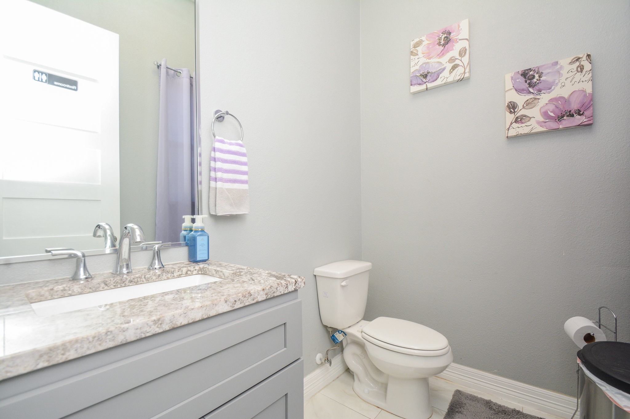 5513 Lotus Street Houston, TX 77085 - Photo 26 of 50 a bathroom with a granite countertop sink mirror vanity and toilet