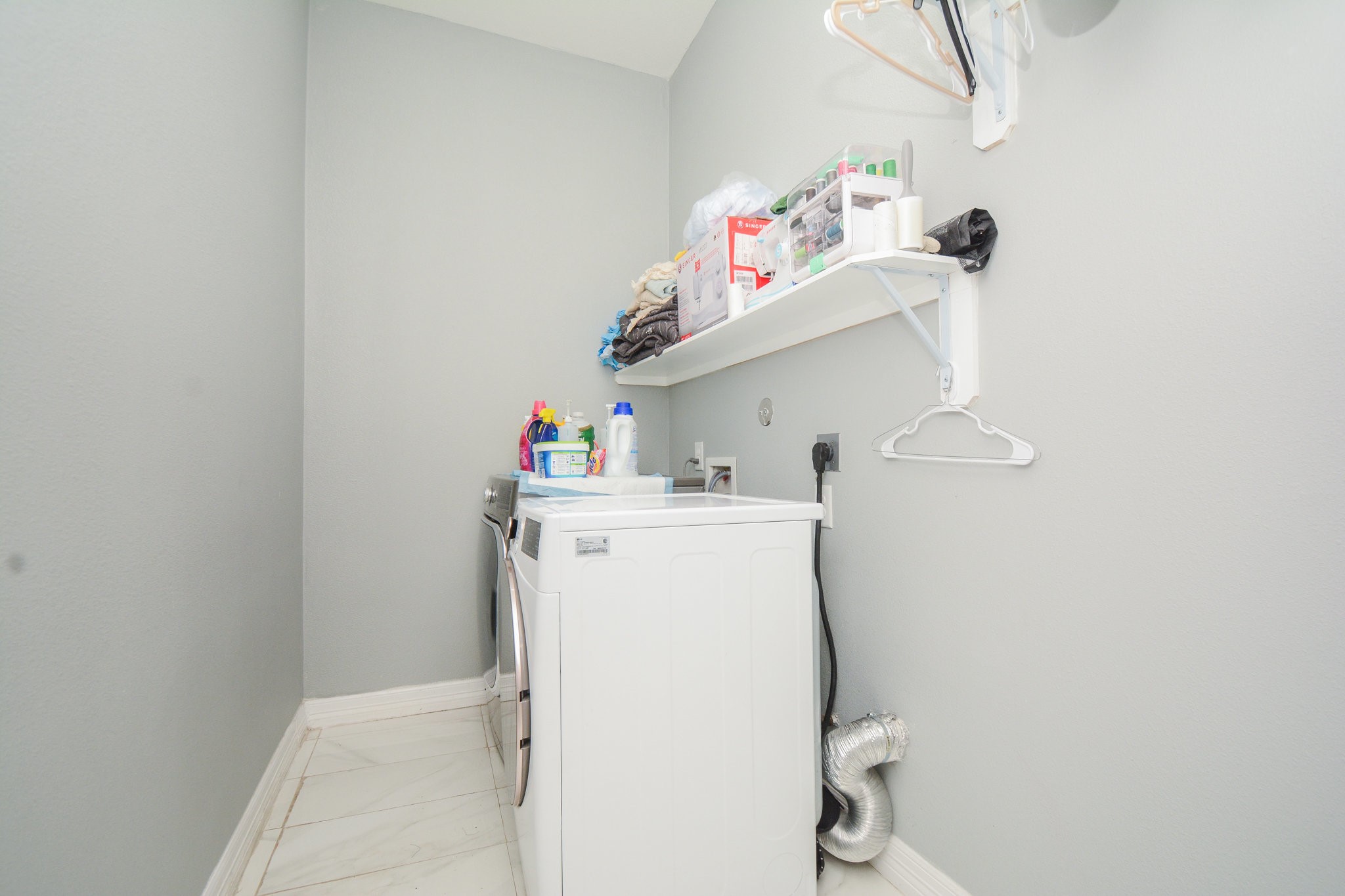 5513 Lotus Street Houston, TX 77085 - Photo 27 of 50 a utility room with dryer and washer