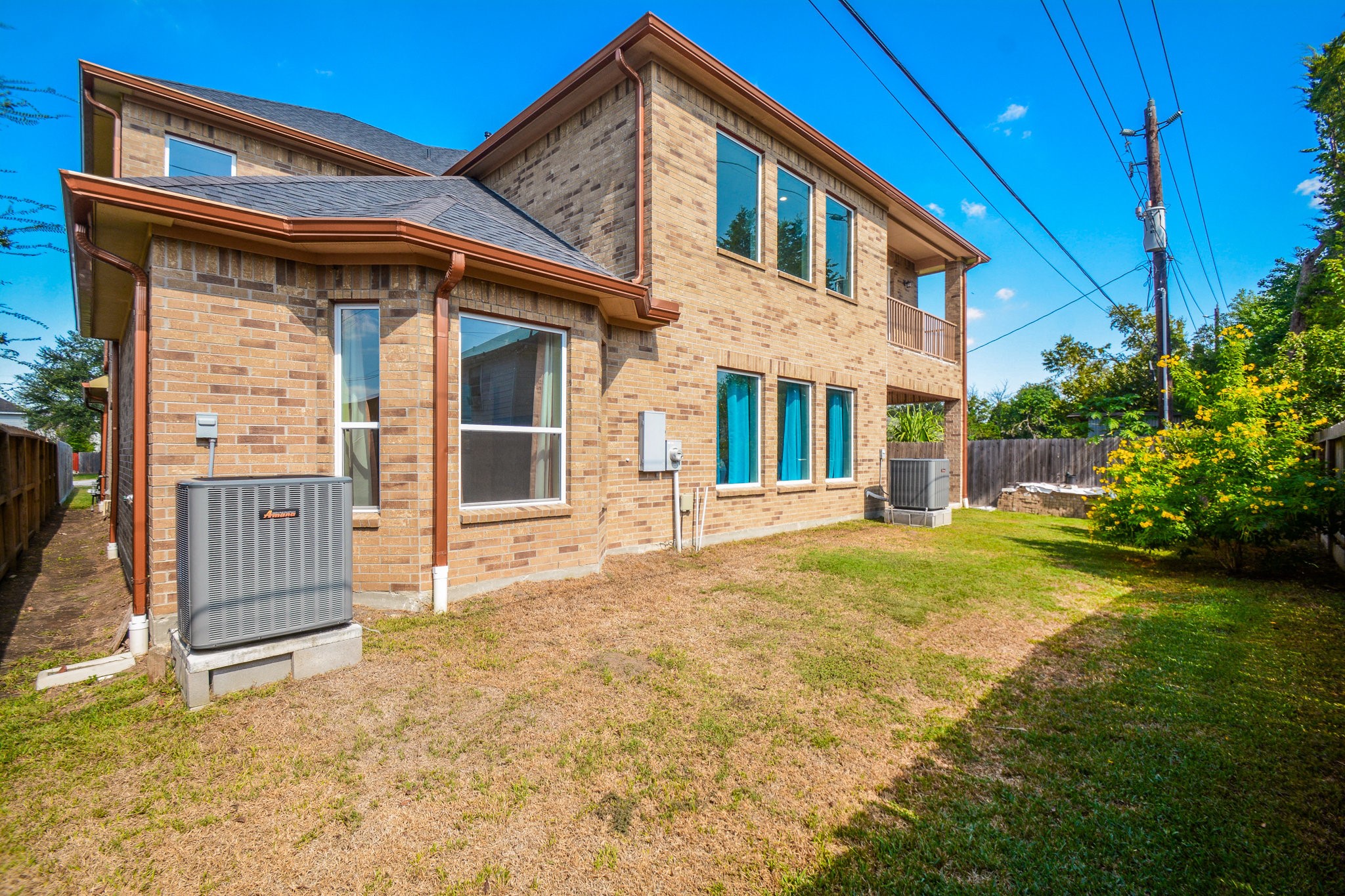5513 Lotus Street Houston, TX 77085 - Photo 30 of 50 a front view of a house with a yard
