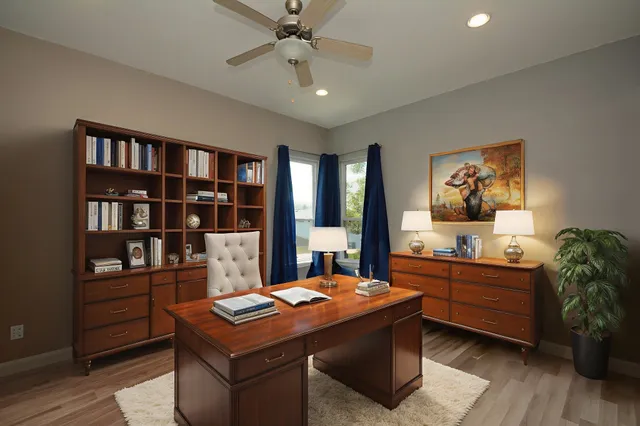 a room with furniture and book shelf