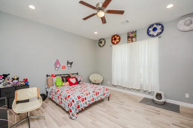 a bedroom with a bed and window