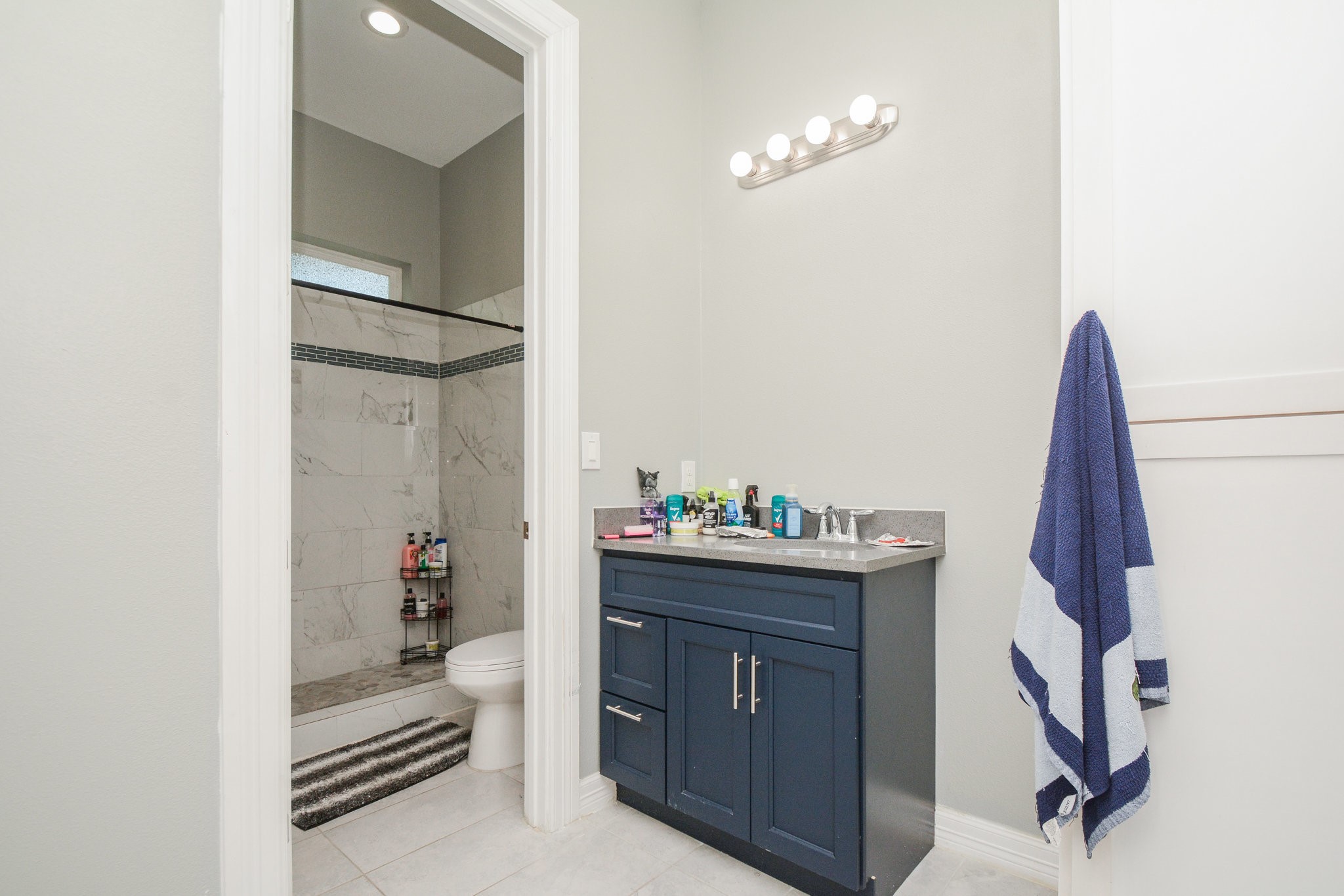 5513 Lotus Street Houston, TX 77085 - Photo 36 of 50 a room with a walk in closet and wooden floor